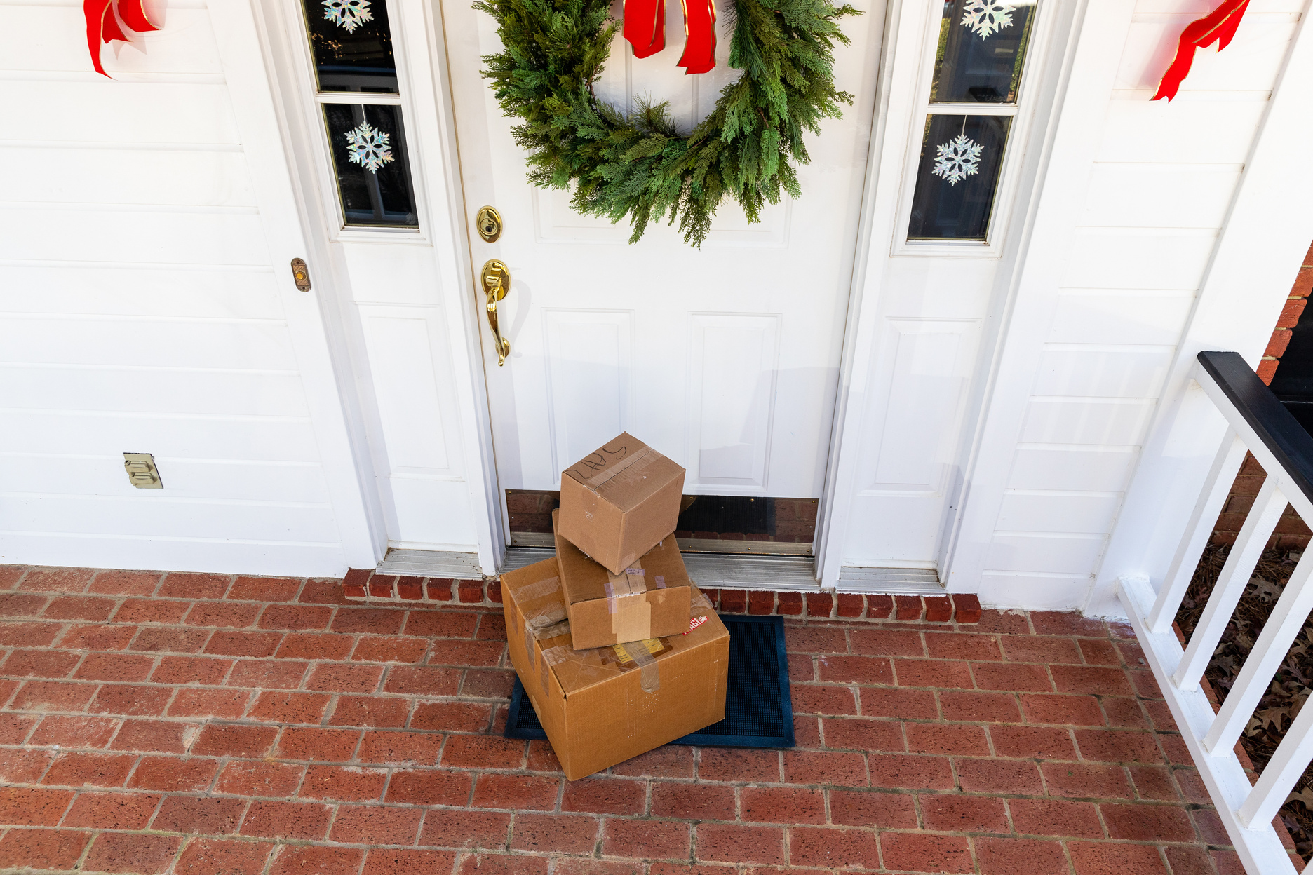 Mail Order packages on front porch during the holiday season